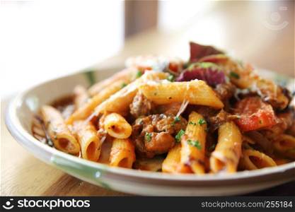 Penne pasta in tomato sauce with meatballs