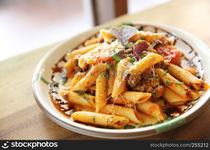 Penne pasta in tomato sauce with meatballs