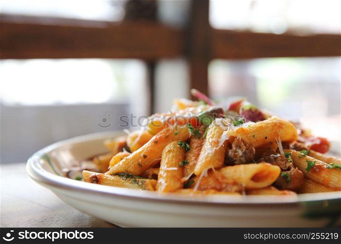 Penne pasta in tomato sauce with meatballs