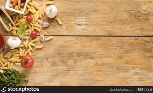 penne pasta with vegetables ingredients old wooden table. High resolution photo. penne pasta with vegetables ingredients old wooden table. High quality photo