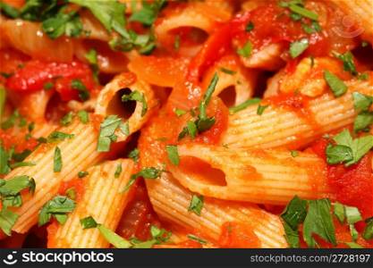 Penne rigate pasta with tomato sauce. background