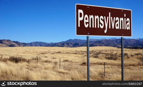 Pennsylvania road sign with blue sky and wilderness