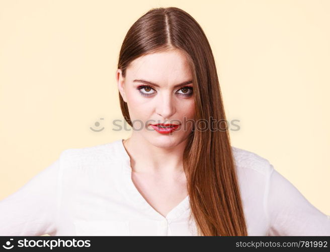 Pensive attractive brunette woman with full makeup having serious, thinking face expression.. Pensive thinking attractive brunette woman