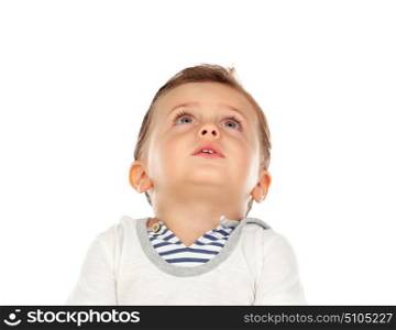 Pensive baby looking up isolated on a white background