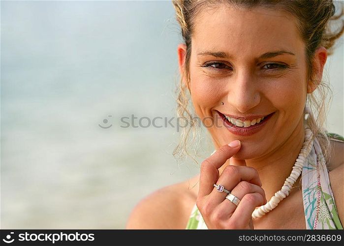 Pensive blond woman at the beach