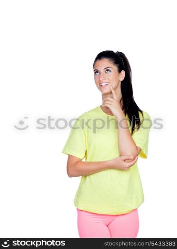 Pensive brunette woman with sport clothing isolated on a white background
