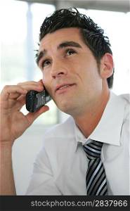 Pensive businessman on the telephone