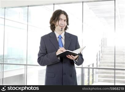 pensive businessman with a book at the office