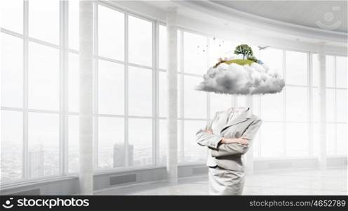Pensive businesswoman in modern interior. Businesswoman with arms crossed on chest and head in cloud
