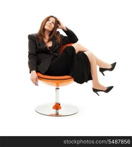 pensive businesswoman with cell phone over white