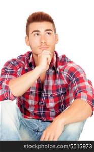 Pensive casual boy sitting with plaid shirt isolated on white background