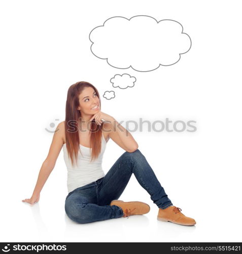 Pensive casual young woman sitting on the floor isolated on a white background