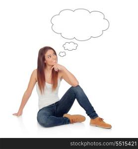 Pensive casual young woman sitting on the floor isolated on a white background