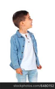 Pensive child with denim shirt looking up isolated on a white background