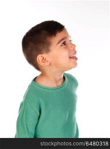 Pensive child with green t-shirt looking up . Pensive child with green t-shirt looking up isolated on a white background