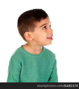 Pensive child with green t-shirt looking up . Pensive child with green t-shirt looking up isolated on a white background