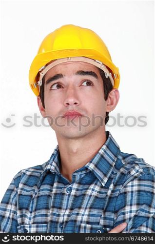 Pensive construction worker