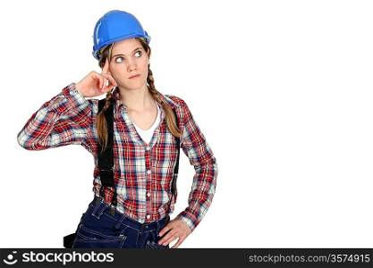 Pensive female builder