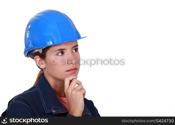Pensive female construction worker.