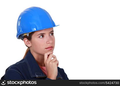 Pensive female construction worker.