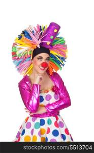 Pensive girl clown with a big colorful wig isolated on white background