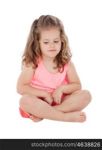 Pensive girl sitting on the floor isolated on a white background