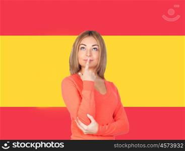 Pensive girl with blond hair with a spanish flag of background