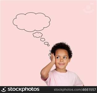 Pensive latin child isolated on a pink background