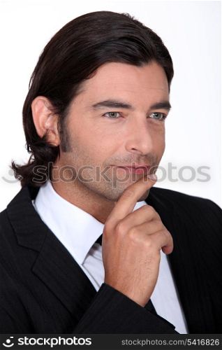 Pensive man dressed in suit