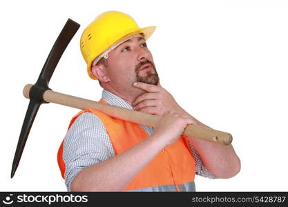 Pensive man with pick ax