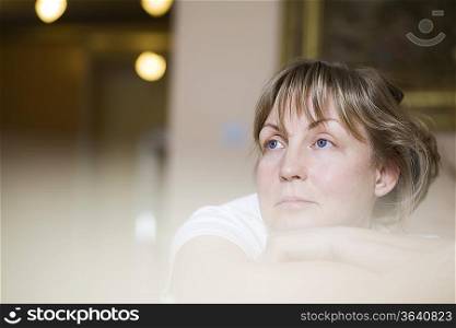 Pensive mature woman, close-up view, selective focus, portrait