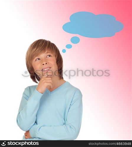 Pensive preteen boy isolated on a over pink background
