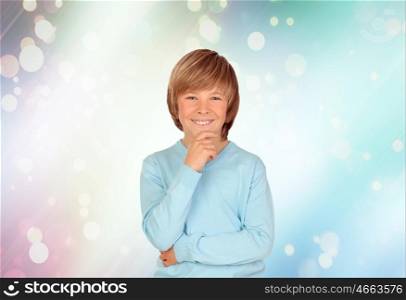 Pensive preteen boy with a blue background with sparkles