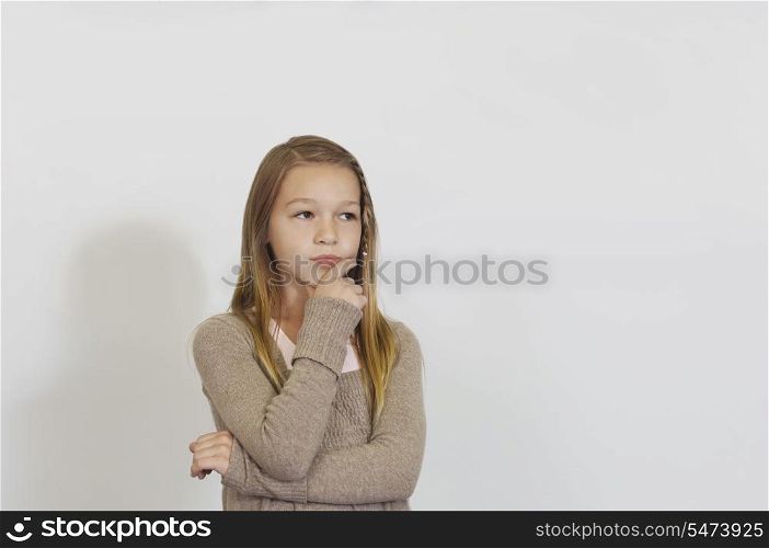 Pensive Schoolgirl against whiteboard
