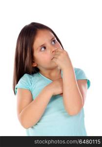 Pensive small girl imagining something isolated on a white background
