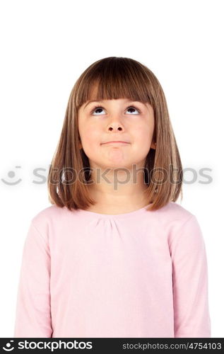 Pensive small girl with pink t-shirt isolated on a white background