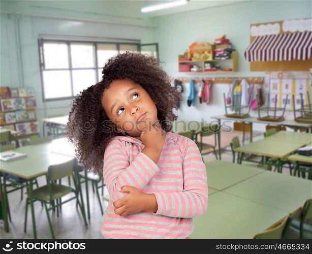 Pensive student african girl with beautiful hairstyle in the school