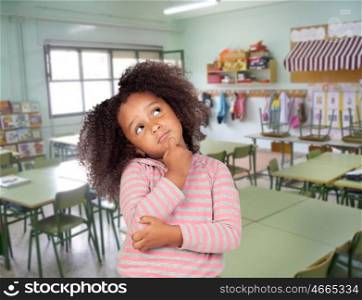 Pensive student african girl with beautiful hairstyle in the school