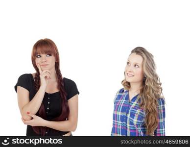 Pensive teenage girl dressed in black with a friend isolated on white background
