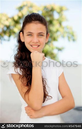 Pensive teenager girl smiling outside