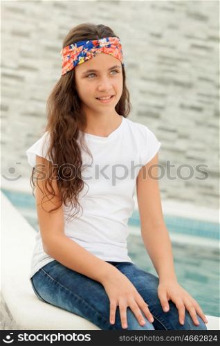 Pensive teenager girl with a flowered headband smiling outside