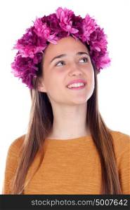 Pensive teenager girl with purple flowers in her head isolated on a white background