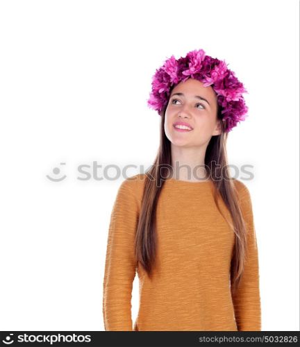 Pensive teenager girl with purple flowers in her head isolated on a white background