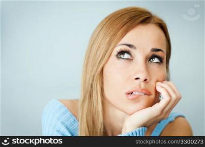 pensive woman biting lips