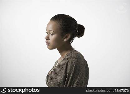 Pensive young woman, profile, close-up view