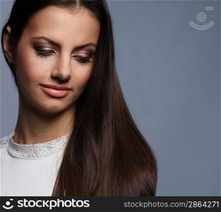 Pensive young woman with beautiful hair