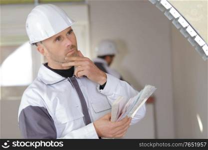 pensive young worker working indoors