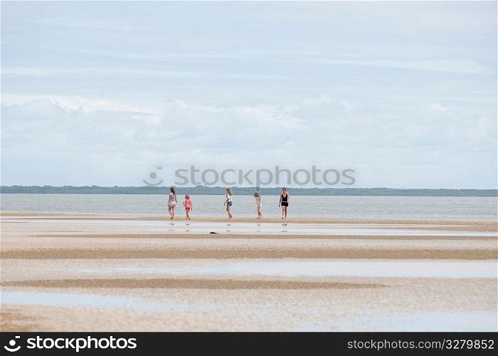 People along shoreline at Manda Bay Resort