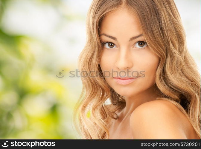 people and beauty concept - beautiful young woman over green background