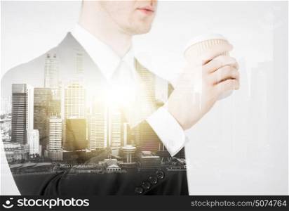 people and business concept - close up of businessman drinking from take away coffee cup over city with double exposure. close up of businessman drinking take away coffee